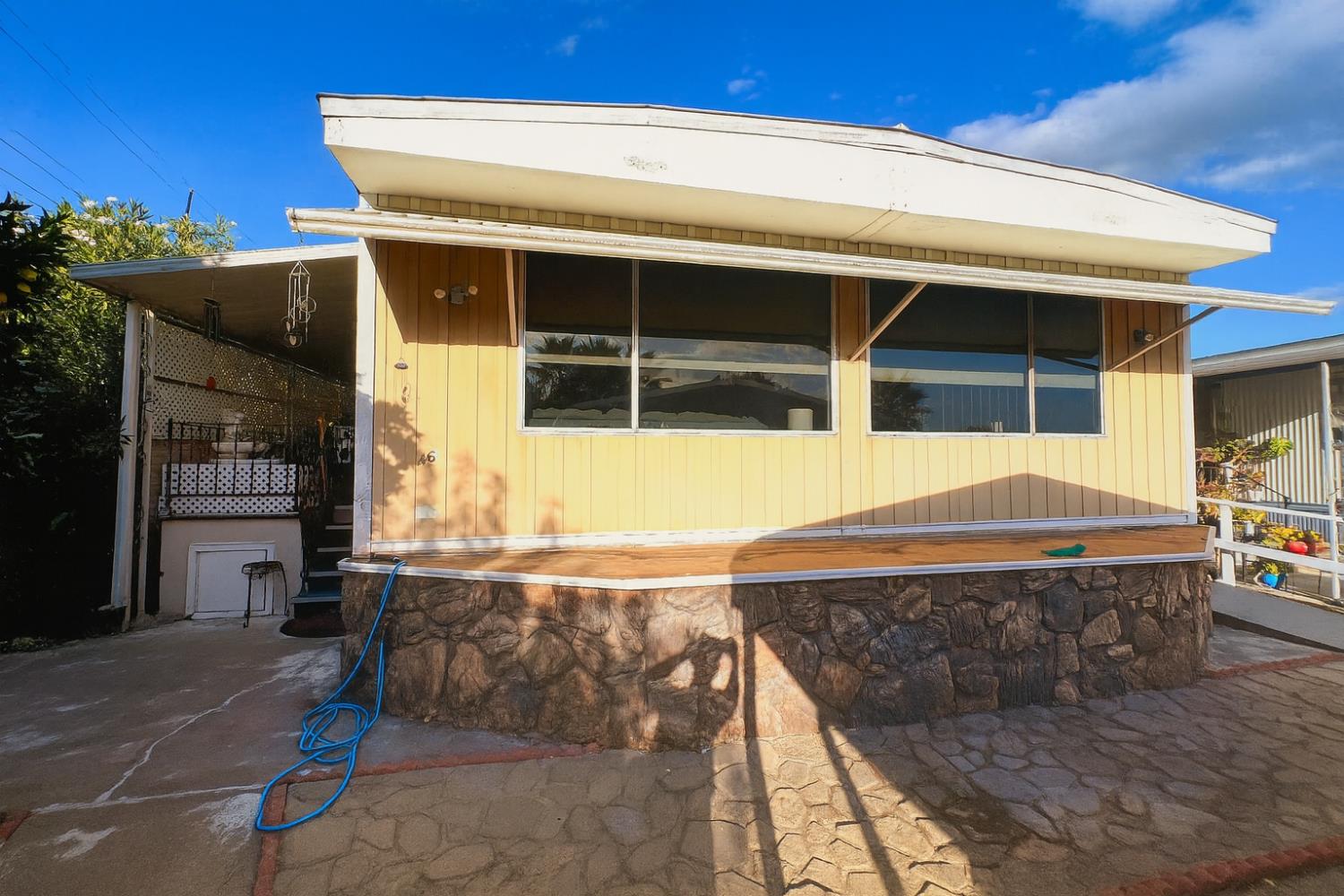 a front view of a house with basket ball court