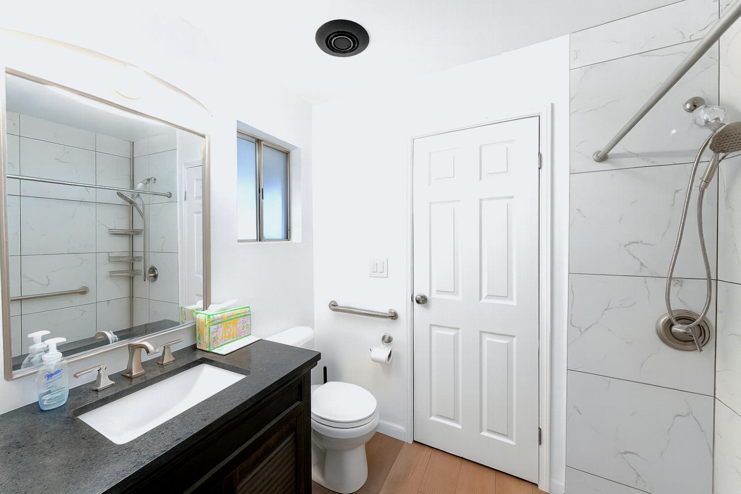 4350 Cherokee Road, Unit 46 Stockton, CA 95215 - Photo 12 of 20 a bathroom with a granite countertop sink toilet and shower