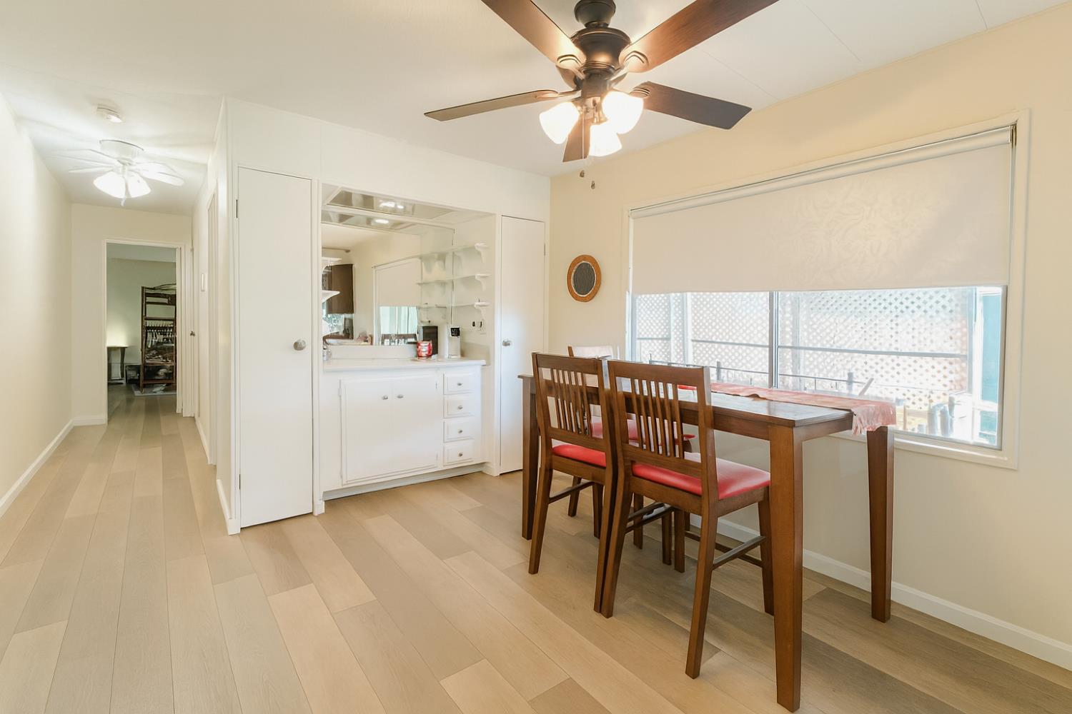 4350 Cherokee Road, Unit 46 Stockton, CA 95215 - Photo 9 of 20 a view of a dining room with furniture and a chandelier