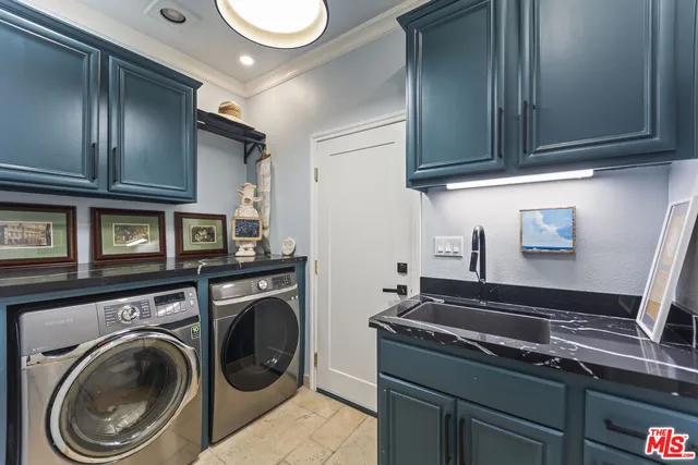 a kitchen with stainless steel appliances granite countertop a sink a stove and cabinets