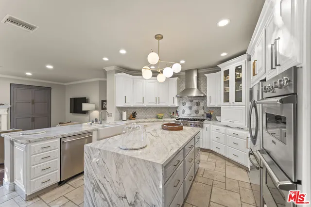 a kitchen with a stove a sink and a refrigerator