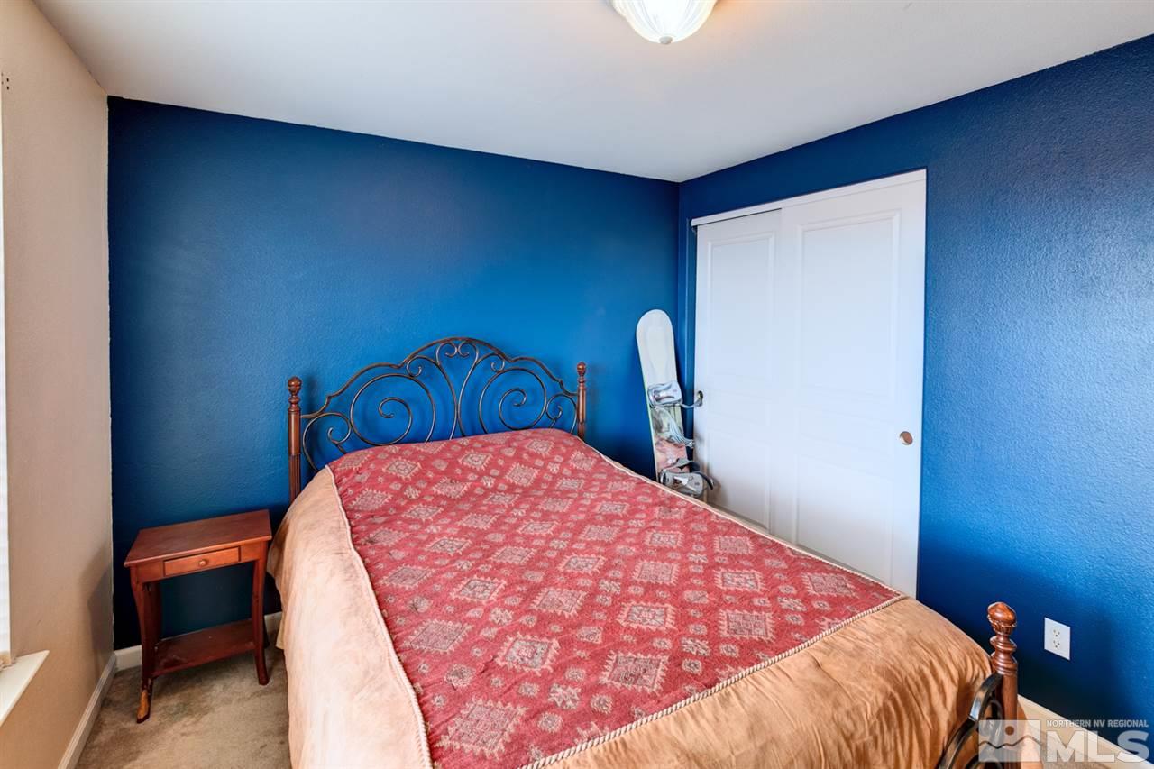 4363 Rancheria Road Fallon, NV 89406 - Photo 11 of 21 a bed sitting in a bedroom next to a window