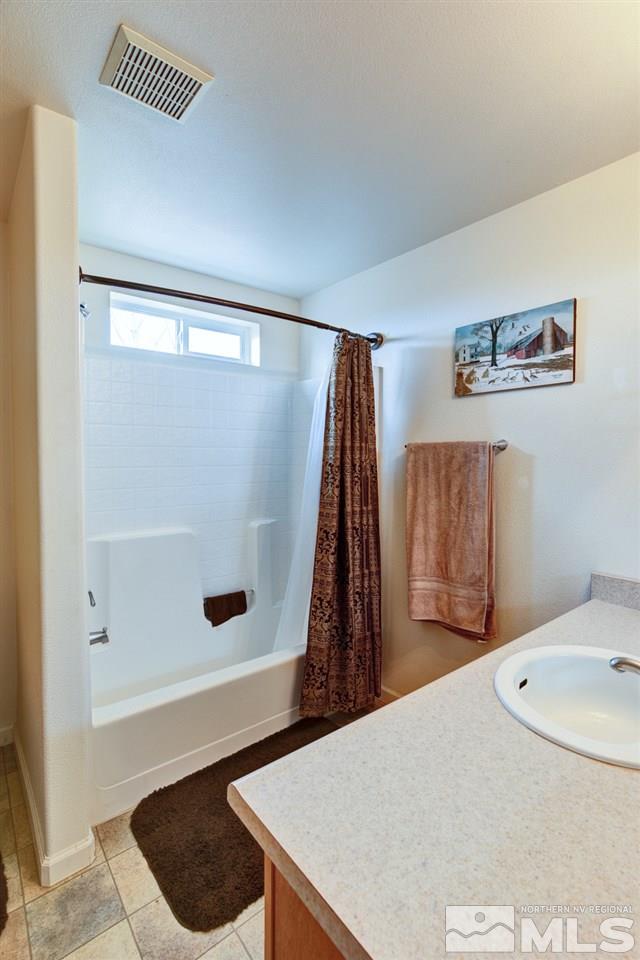 4363 Rancheria Road Fallon, NV 89406 - Photo 12 of 21 a bathroom with a sink and a mirror