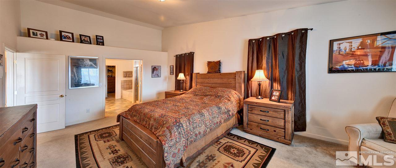4363 Rancheria Road Fallon, NV 89406 - Photo 14 of 21 a bedroom with furniture and flat screen tv
