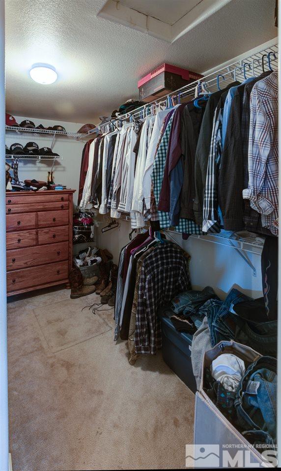 4363 Rancheria Road Fallon, NV 89406 - Photo 15 of 21 a view of walk in closet with clothes and shoes