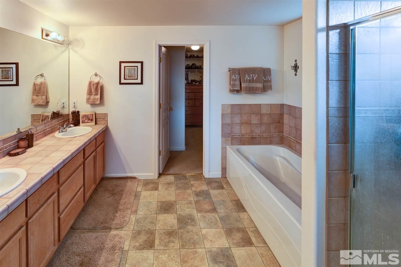4363 Rancheria Road Fallon, NV 89406 - Photo 16 of 21 a bathroom with a tub sink and mirror