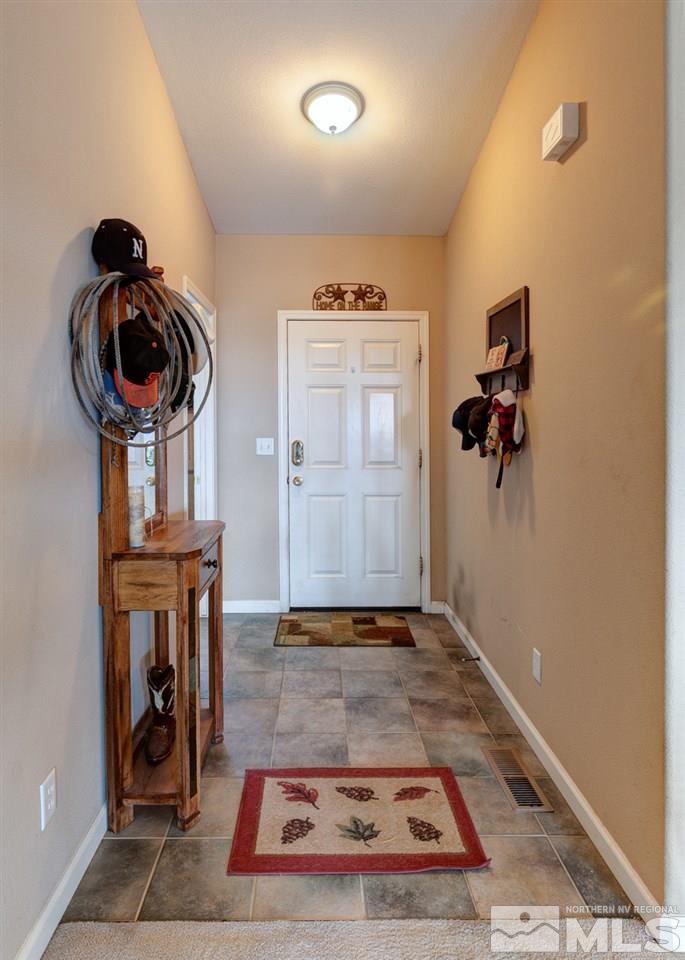 4363 Rancheria Road Fallon, NV 89406 - Photo 4 of 21 a view of a livingroom with wooden floor