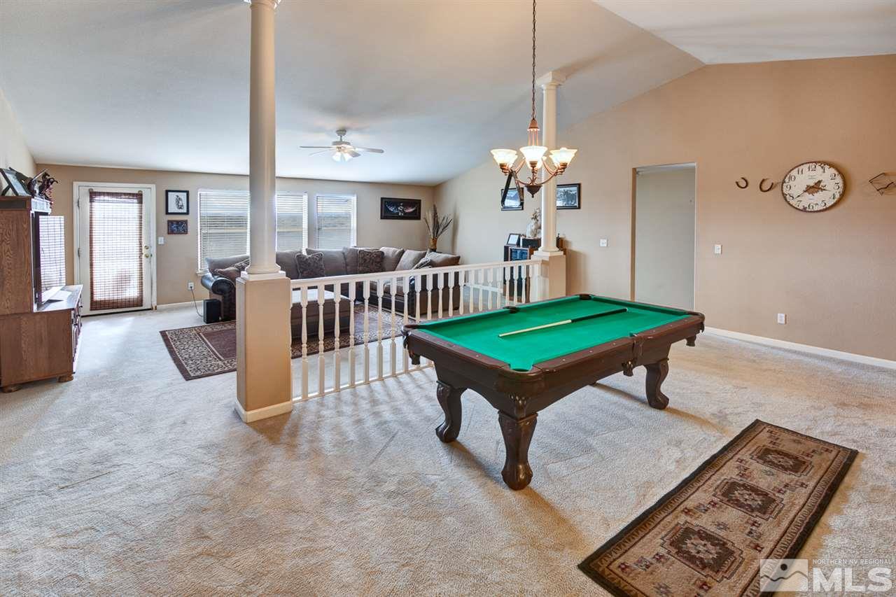 4363 Rancheria Road Fallon, NV 89406 - Photo 5 of 21 a living room with a baby crib furniture and a chandelier
