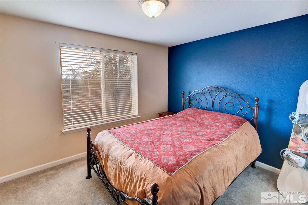 4363 Rancheria Road Fallon, NV 89406 - Photo 10 of 21 a bedroom with a bed and a window