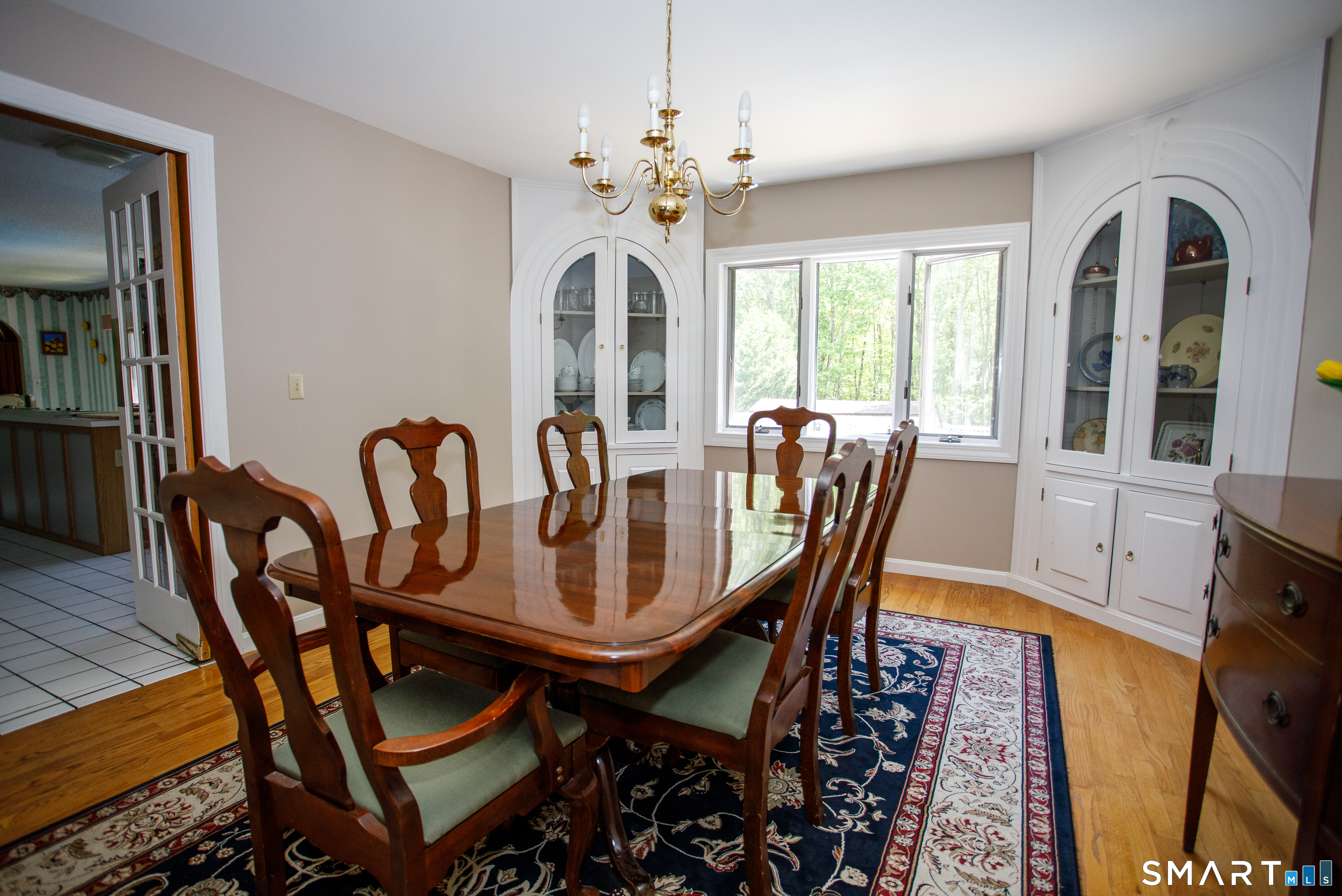 25 Stony Ridge Road Norwich, CT 06360 - Photo 11 of 40 a view of a dining room with furniture a chandelier and wooden floor