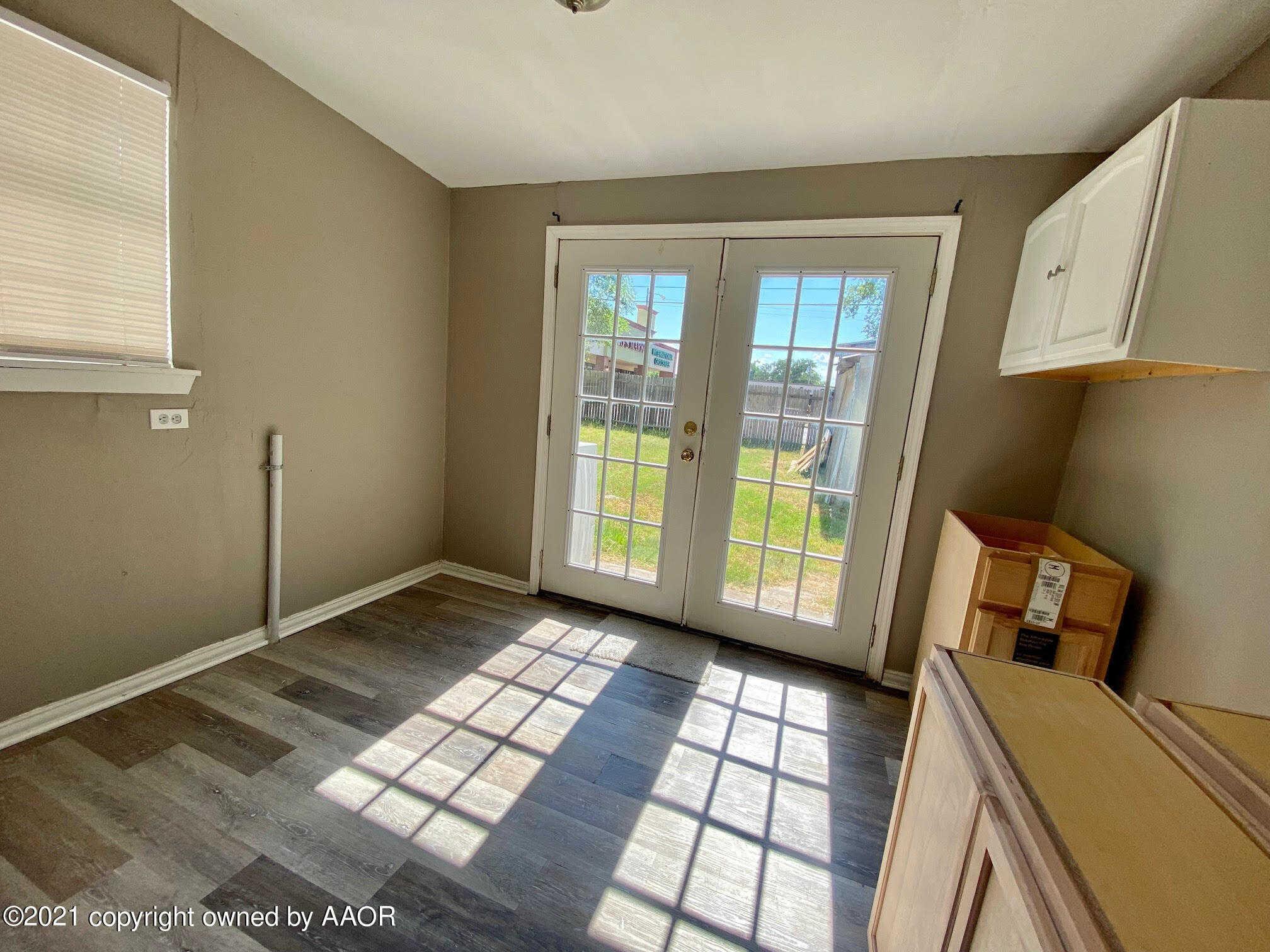 4008 South Monroe Street Amarillo, TX 79110 - Photo 4 of 9 a view of a room with window and hardwood floor