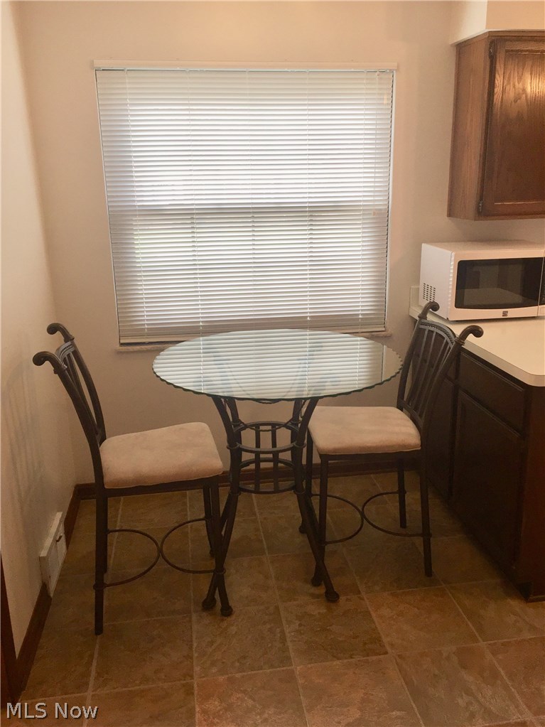 9750 Snow Road Cleveland, OH 44130 - Photo 5 of 24 Charming eat-in Kitchen with newer blinds (2015) throughout the house will stay!