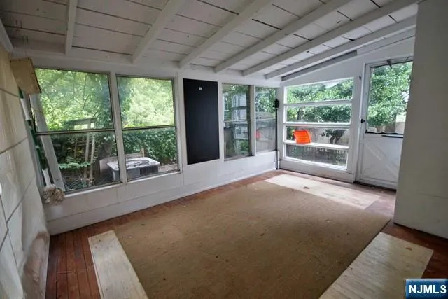 a view of empty room with windows