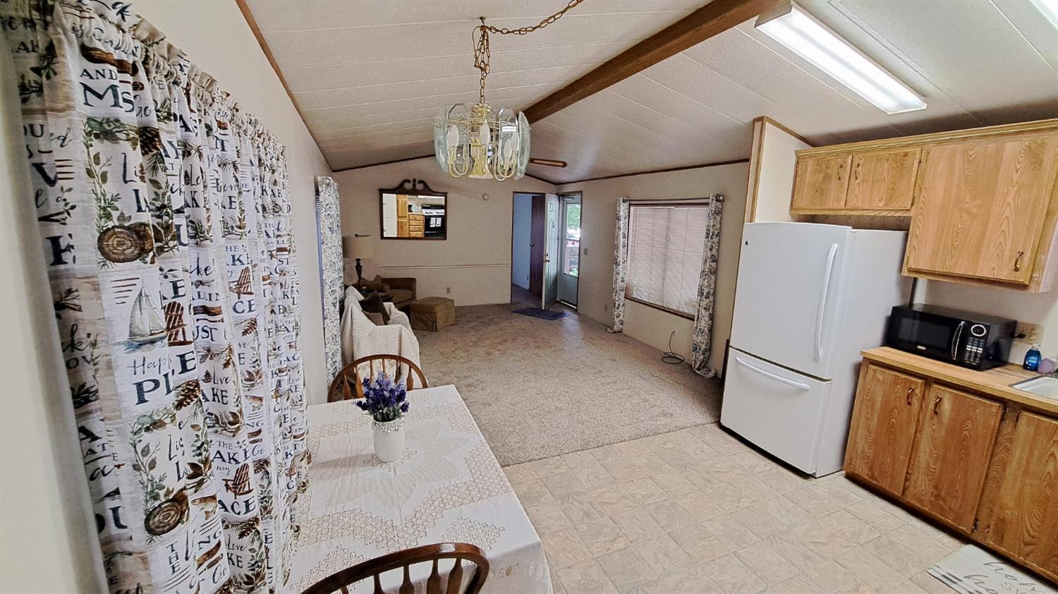 5766 Pony Express Trail, Unit 4 Pollock Pines, CA 95726 - Photo 7 of 17 a kitchen with stainless steel appliances granite countertop a refrigerator and a stove