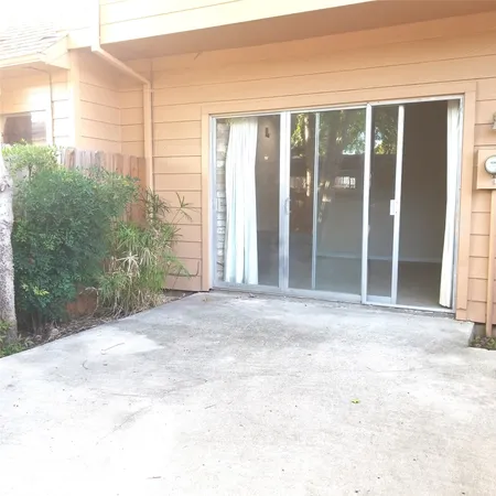 a view of a back yard from a balcony