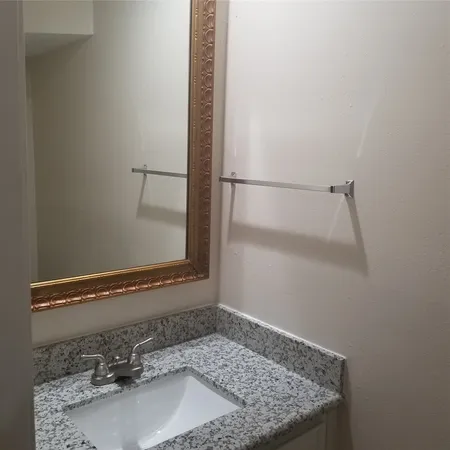 a view of staircase with white walls