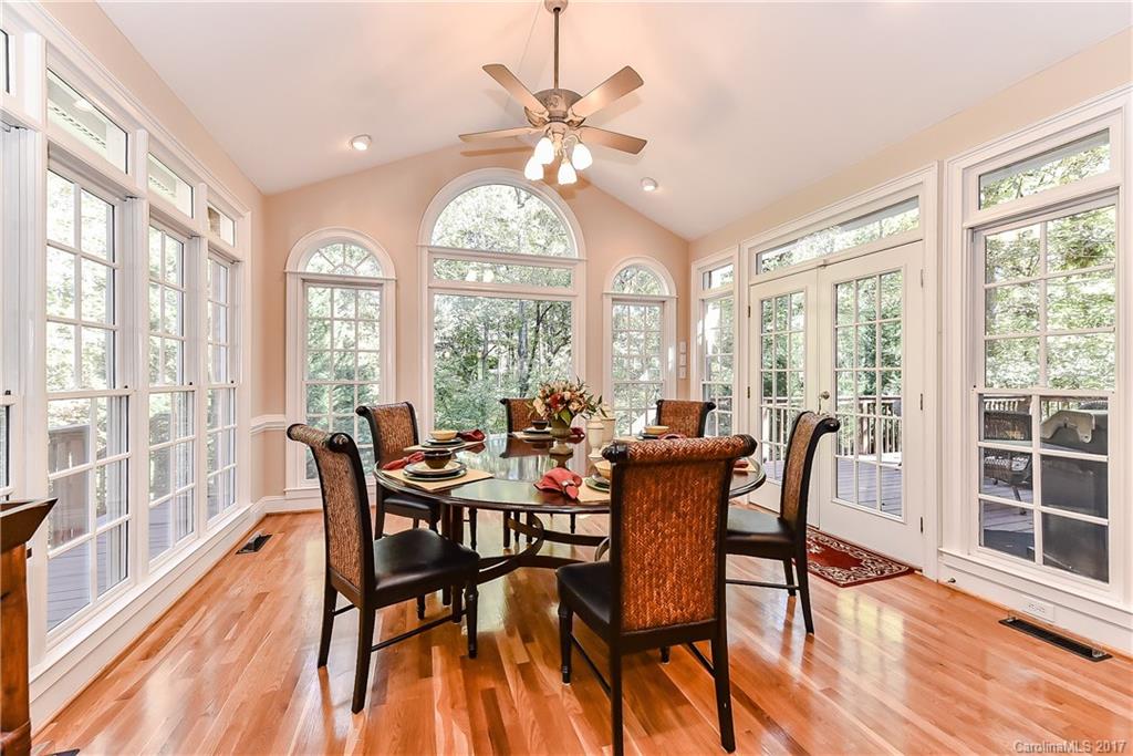 1621 Windy Ridge Road Charlotte, NC 28270 - Photo 6 of 24 a view of a dining room with furniture window and wooden floor