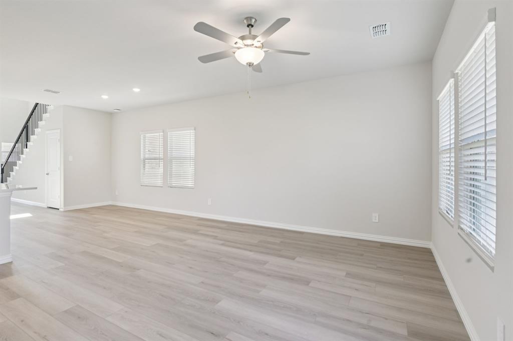 1720 Arches Road Anna, TX 75409 - Photo 12 of 31 wooden floor in an empty room with a window