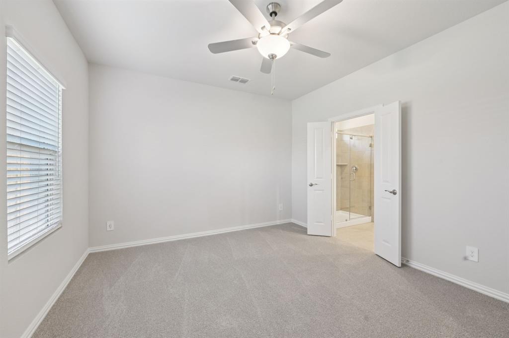1720 Arches Road Anna, TX 75409 - Photo 17 of 31 an empty room with a window and a ceiling fan