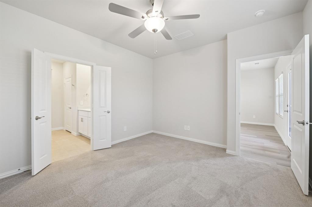1720 Arches Road Anna, TX 75409 - Photo 18 of 31 an empty room with closet and a ceiling fan