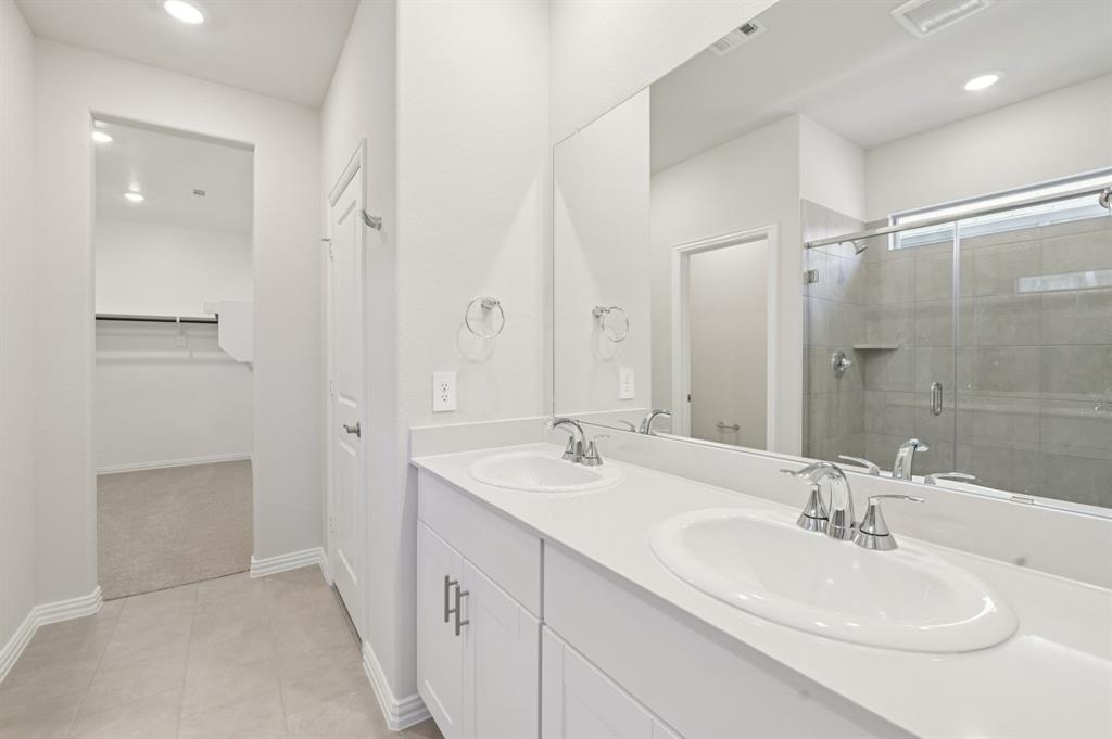 1720 Arches Road Anna, TX 75409 - Photo 19 of 31 a bathroom with a sink and a mirror