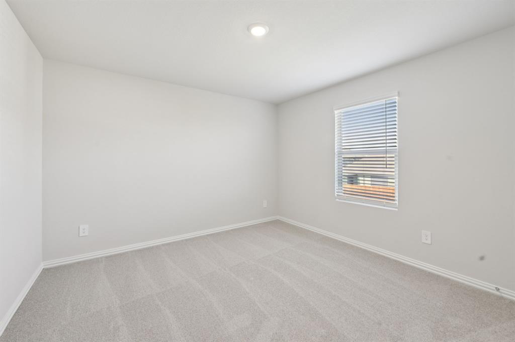 1720 Arches Road Anna, TX 75409 - Photo 29 of 31 an empty room with a window
