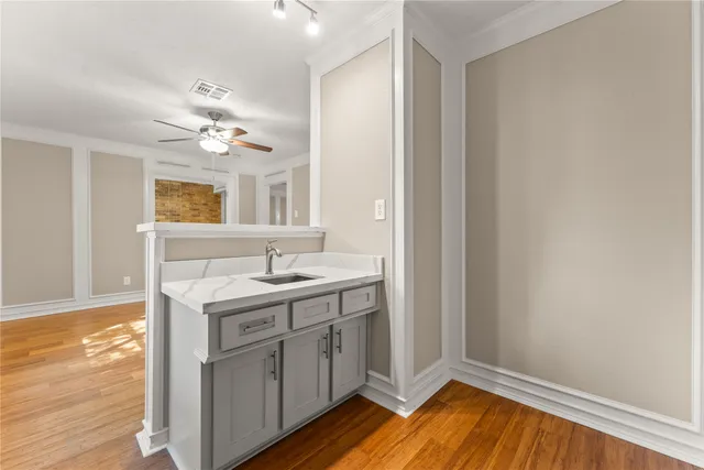 a view with cabinets a sink and dishwasher in it
