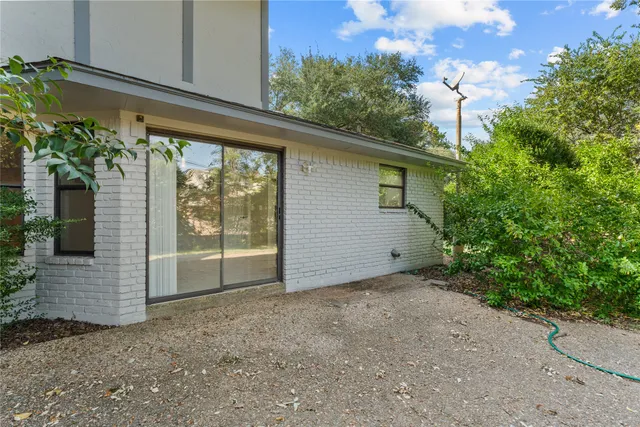 a view of backyard with green space
