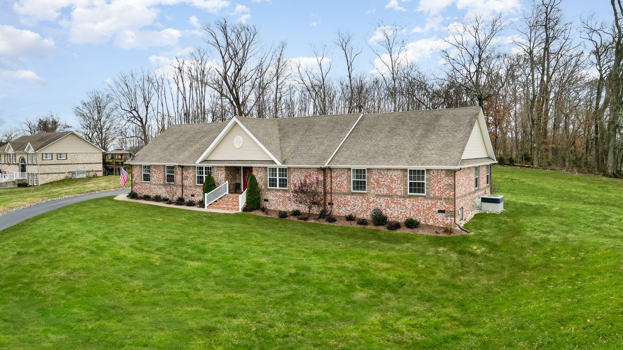 1525 Heller Ridge Spring Hill, TN 37174 - Photo 2 of 57 a aerial view of a house next to a big yard and large trees
