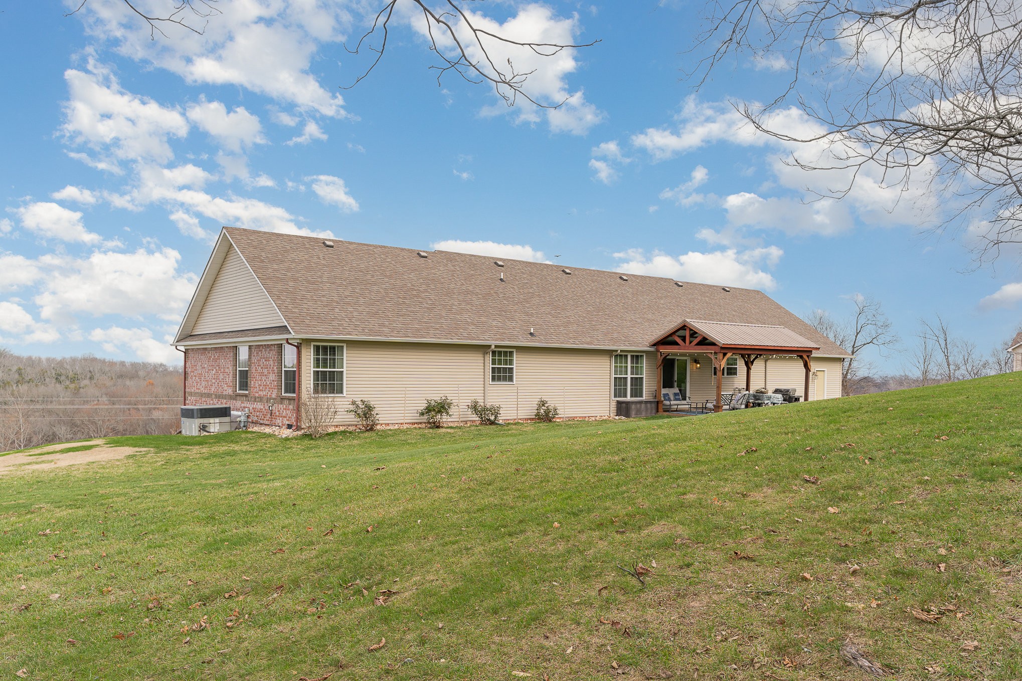 1525 Heller Ridge Spring Hill, TN 37174 - Photo 32 of 57 a view of a house with a big yard and large tree