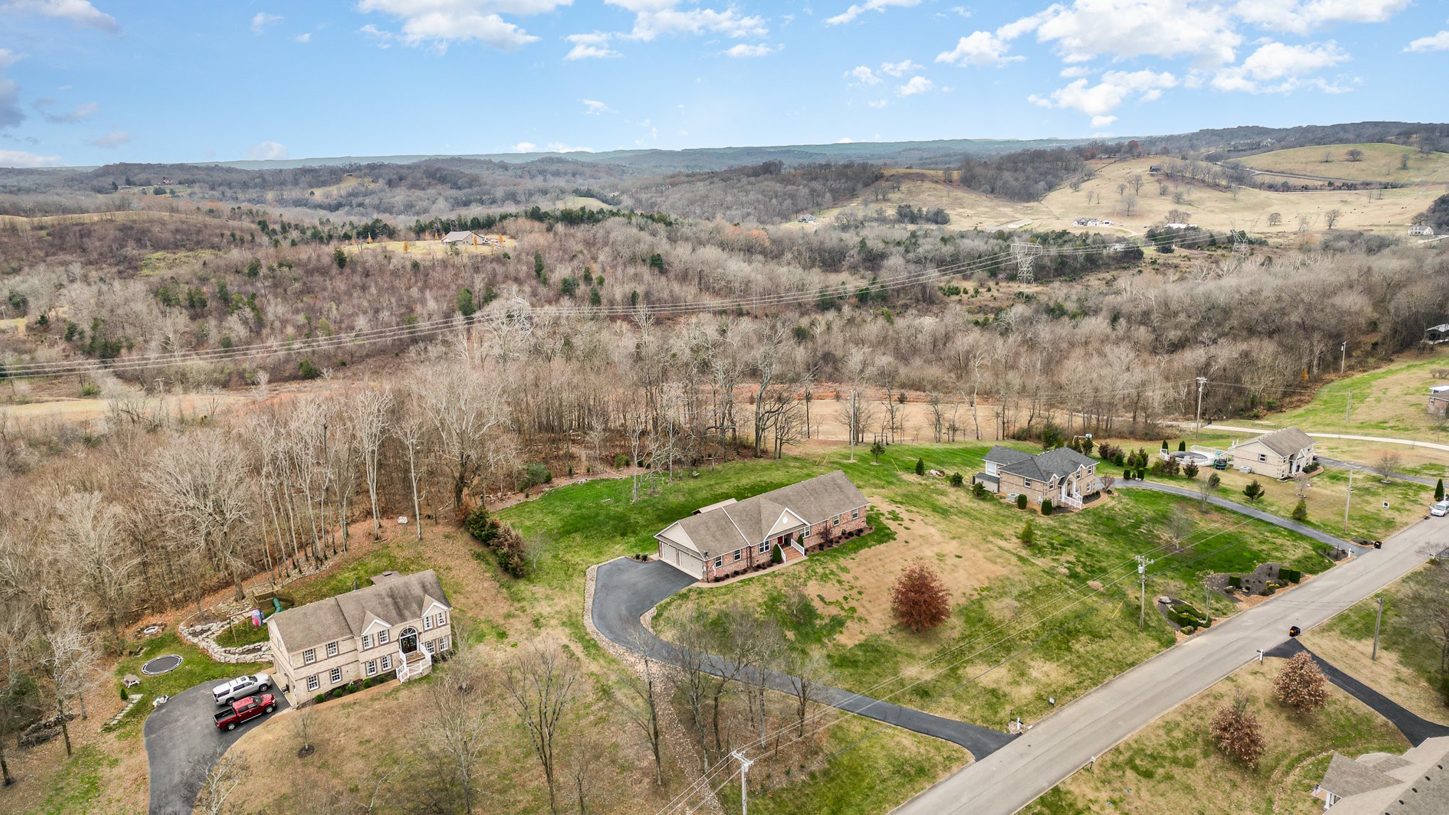 1525 Heller Ridge Spring Hill, TN 37174 - Photo 47 of 57 an aerial view of a house with a yard and lake view