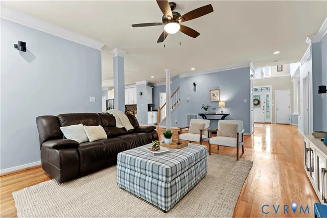 a living room with furniture a window and gym equipment
