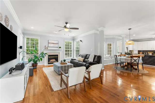 a living room with furniture fireplace and flat screen tv
