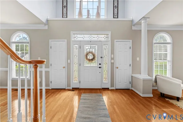 a kitchen with stainless steel appliances granite countertop a refrigerator a stove and a sink