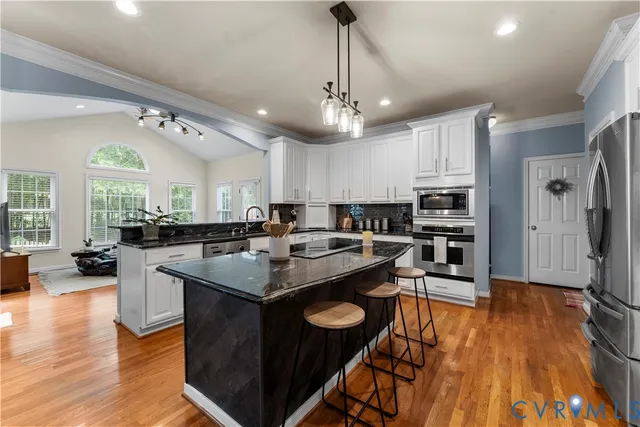 a bathroom with a bathtub and a window