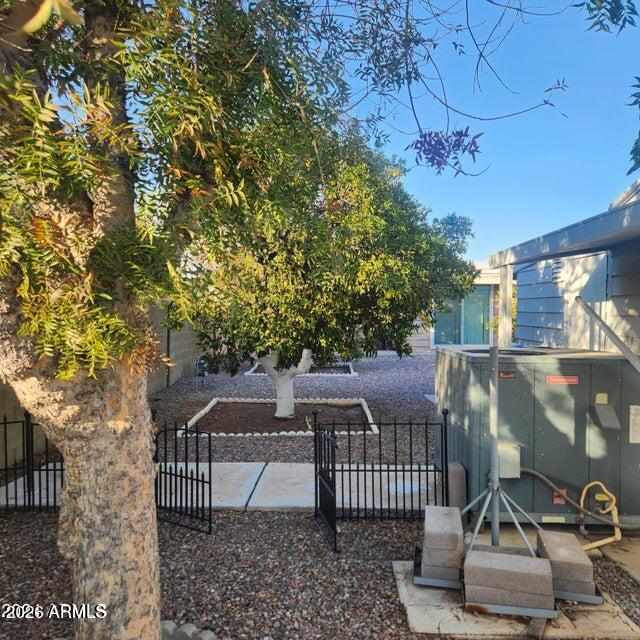 3160 East Main Street, Unit 72 Mesa, AZ 85213 - Photo 4 of 8 a view of a chairs and table in the patio
