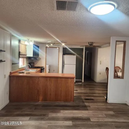 a view of room with wooden floor
