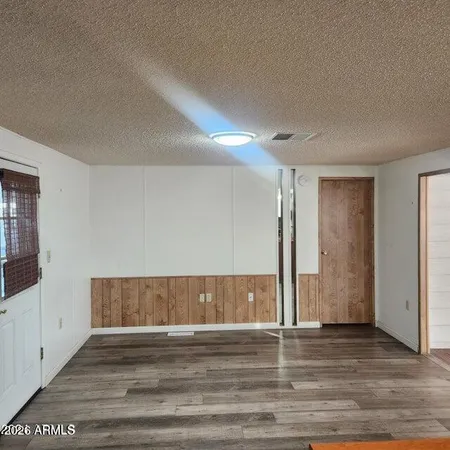a view of entryway with wooden floor