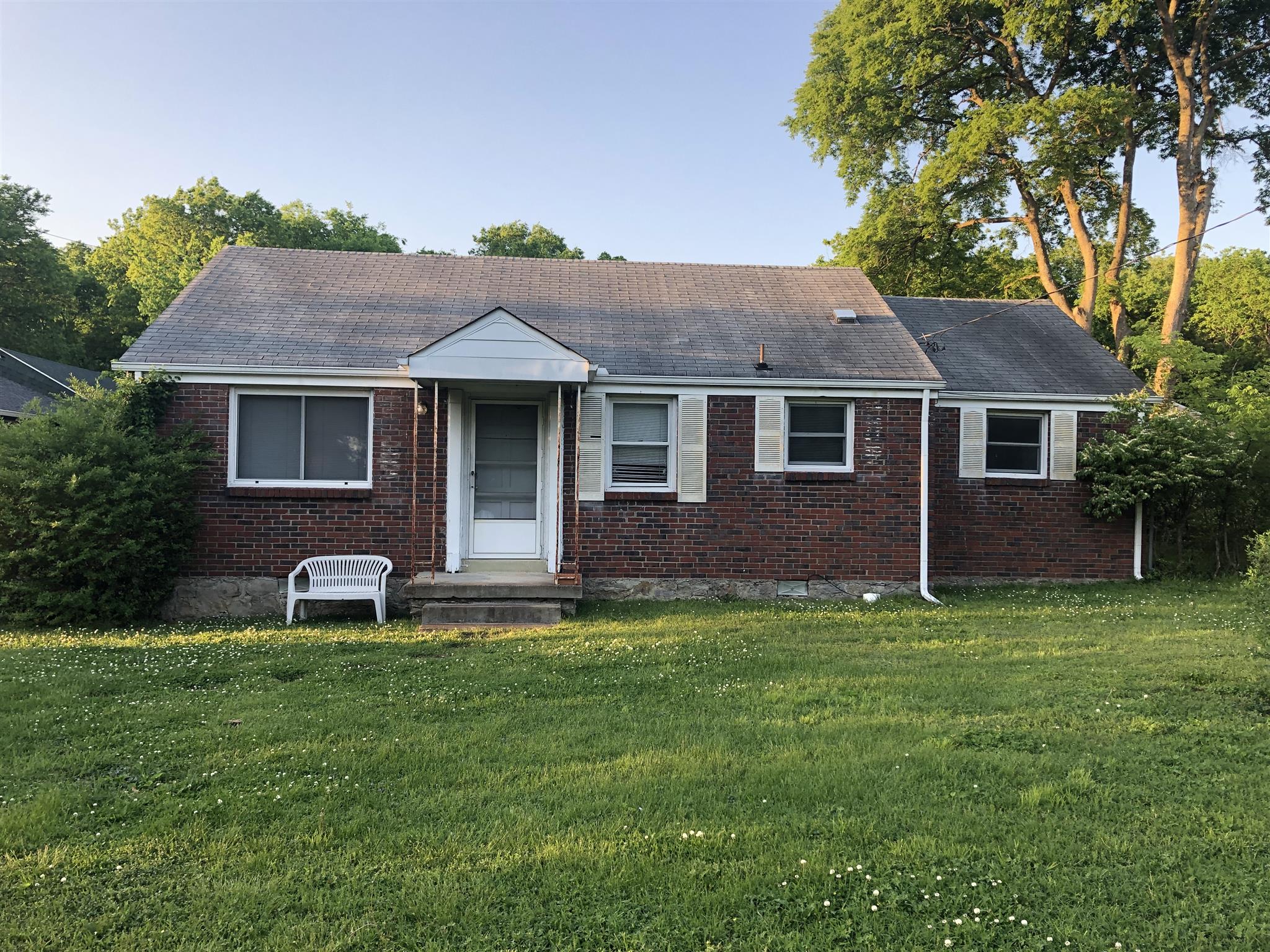 637 Neelys Bend Road Madison, TN 37115 - Photo 1 of 15 a front view of a house with a yard and fence