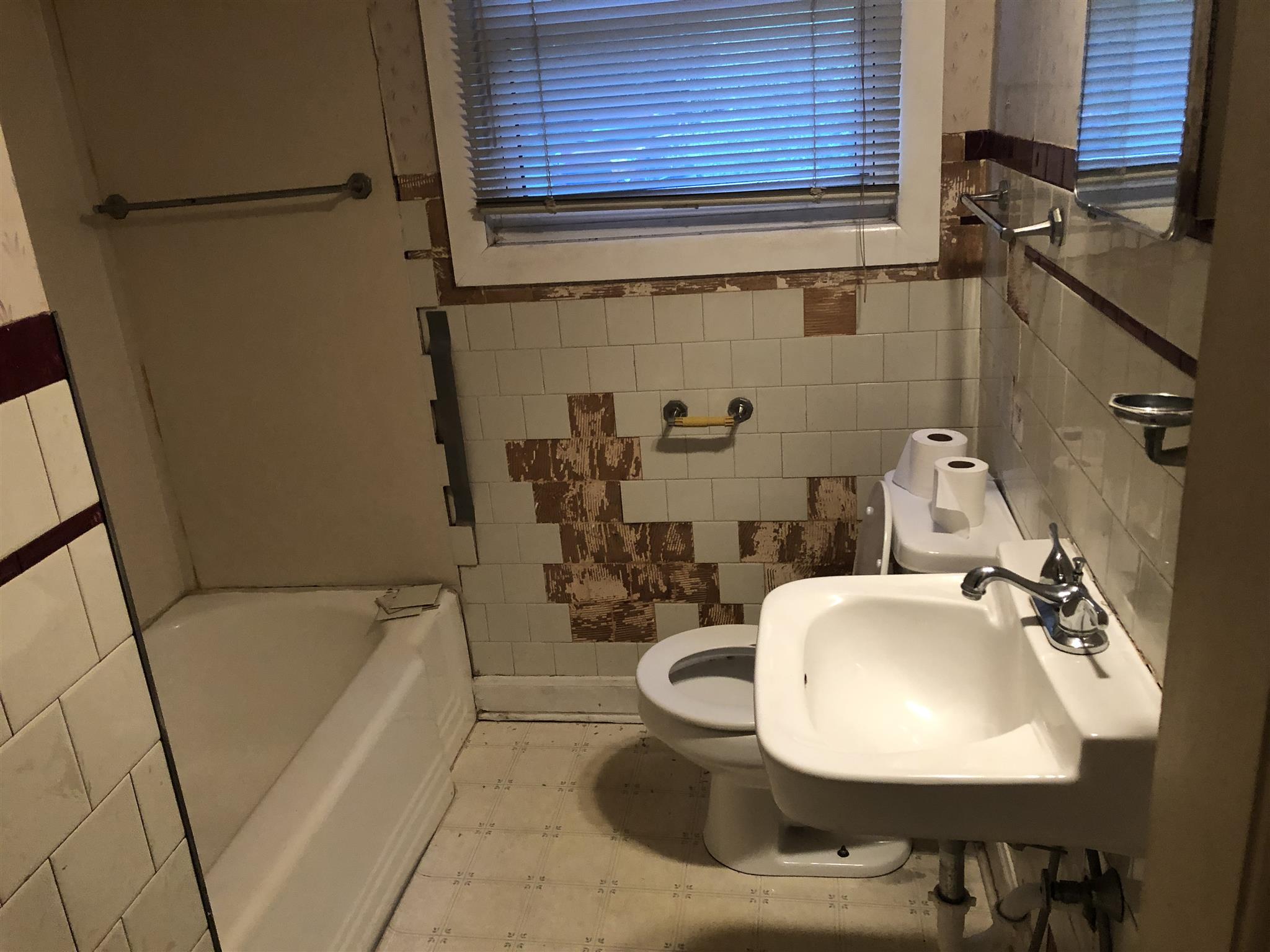 637 Neelys Bend Road Madison, TN 37115 - Photo 8 of 15 a bathroom with a sink and mirror with bathtub