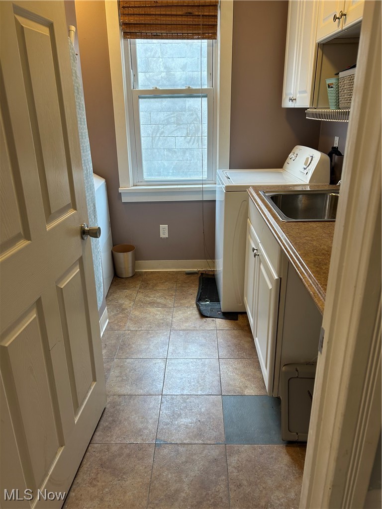 Utility room on main floor with both washer and dryer.