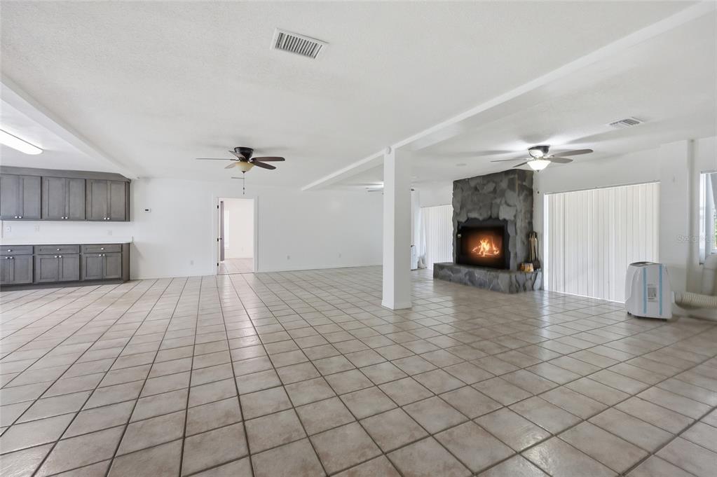 401 Southeast Falcon Road Branford, FL 32008 - Photo 57 of 76 a view of a livingroom with a fireplace and a chandelier