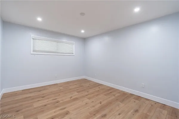 a view of room with wooden floor