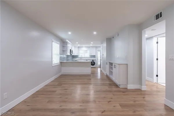 a view of kitchen with wooden floor