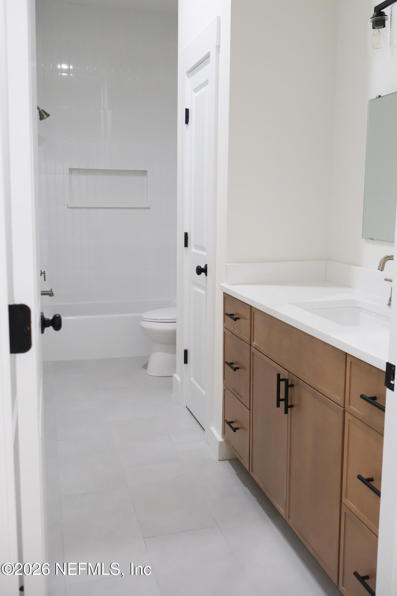 261121 Rowe Road Hilliard, FL 32046 - Photo 24 of 33 a bathroom with a sink a toilet and shower