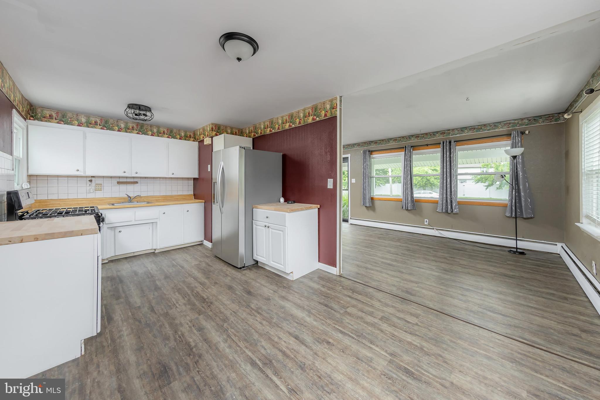 1510 Good Intent Road Deptford, NJ 08096 - Photo 12 of 20 a kitchen with a wooden floor and white appliances
