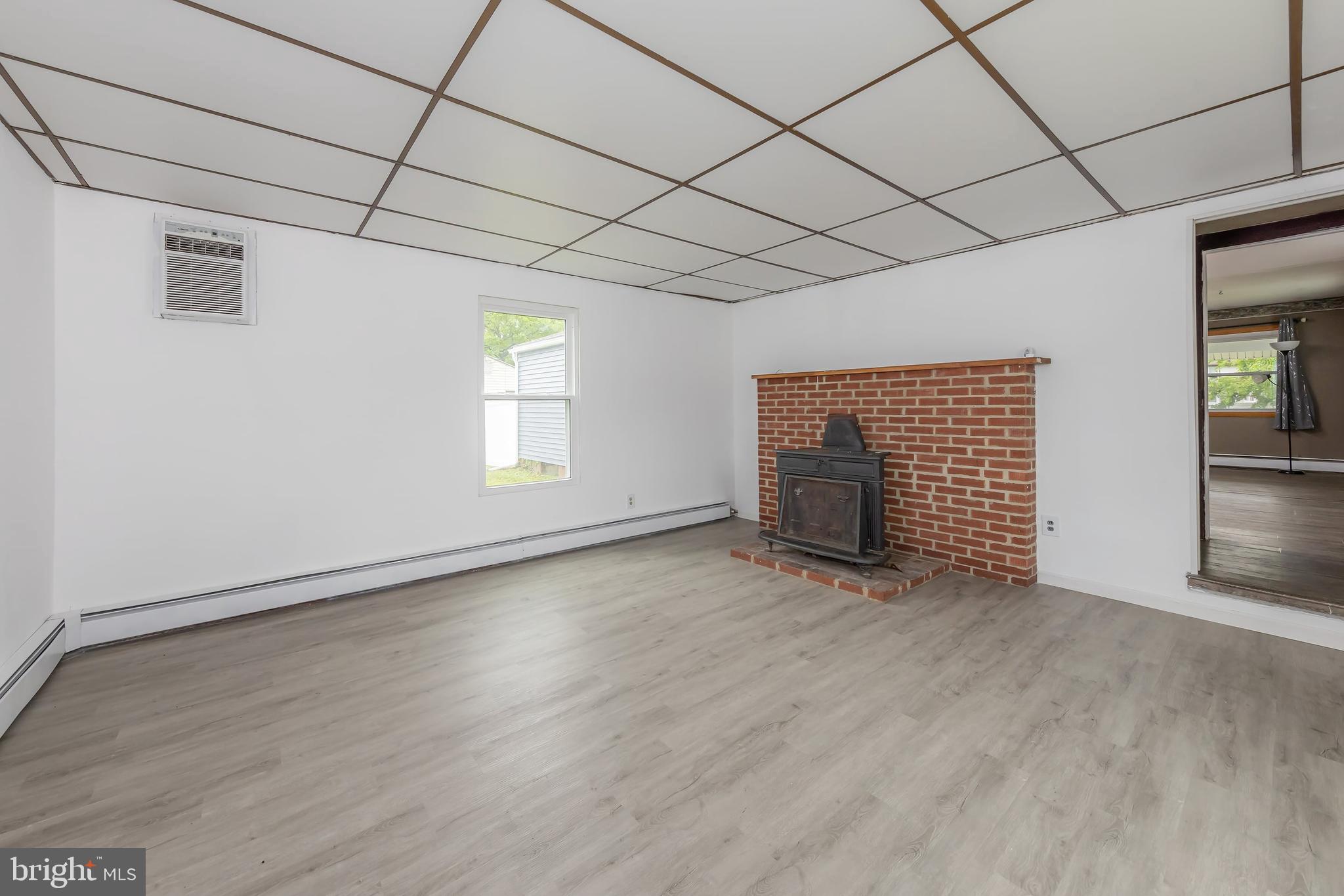 1510 Good Intent Road Deptford, NJ 08096 - Photo 14 of 20 an empty room with wooden floor and windows