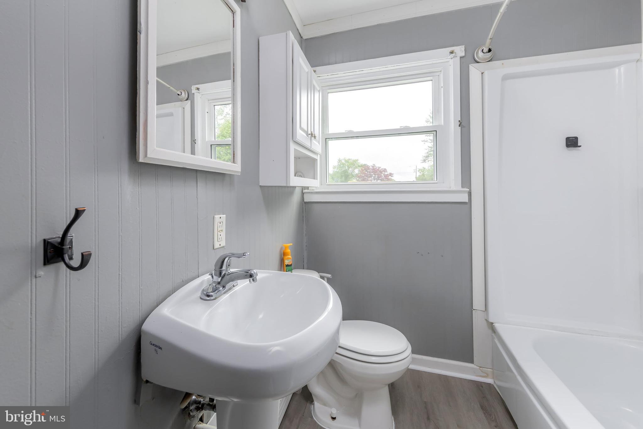 1510 Good Intent Road Deptford, NJ 08096 - Photo 18 of 20 a bathroom with a sink a toilet and a window