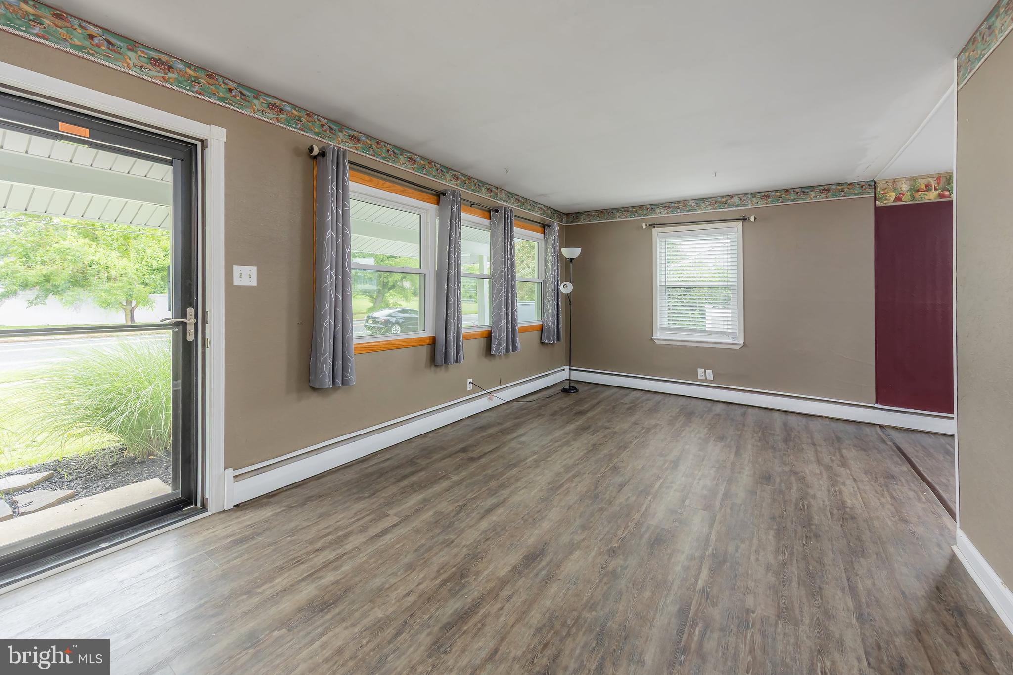 1510 Good Intent Road Deptford, NJ 08096 - Photo 7 of 20 a view of an empty room with a window and wooden floor