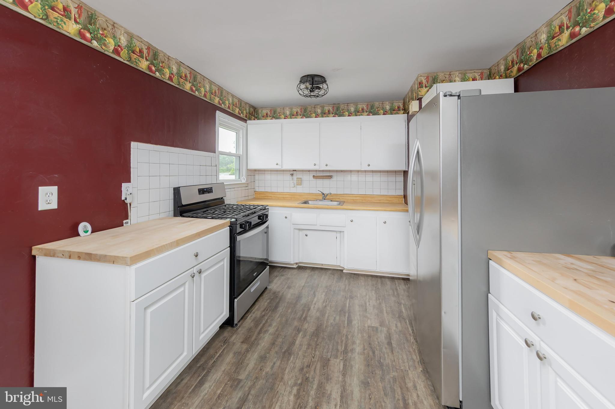 1510 Good Intent Road Deptford, NJ 08096 - Photo 9 of 20 a kitchen with a white cabinets stove and refrigerator